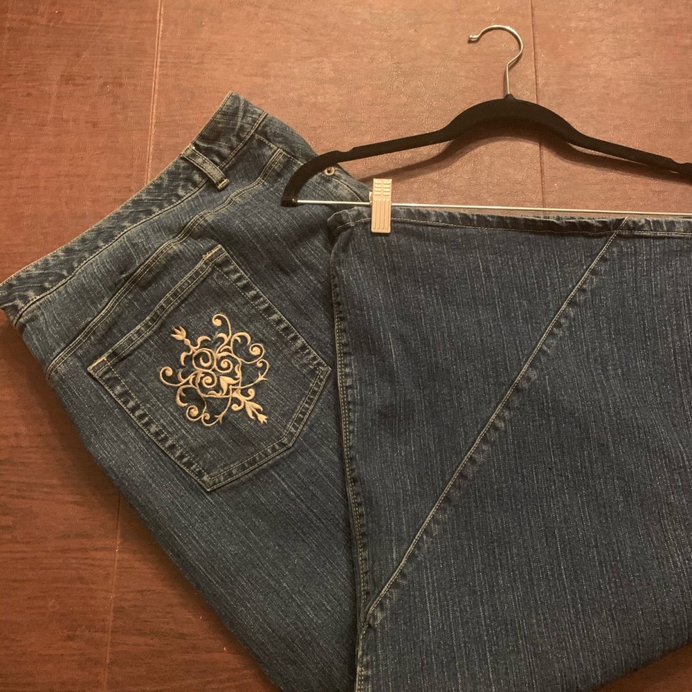 Long denim skirt with decorated pockets